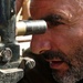 Afghan Artillery Officer Trains on D-30 Howitzer at Forward Operating Base