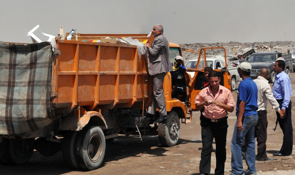Basra Municipality Official Inspects Truck at City Dump