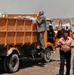 Basra Municipality Official Inspects Truck at City Dump
