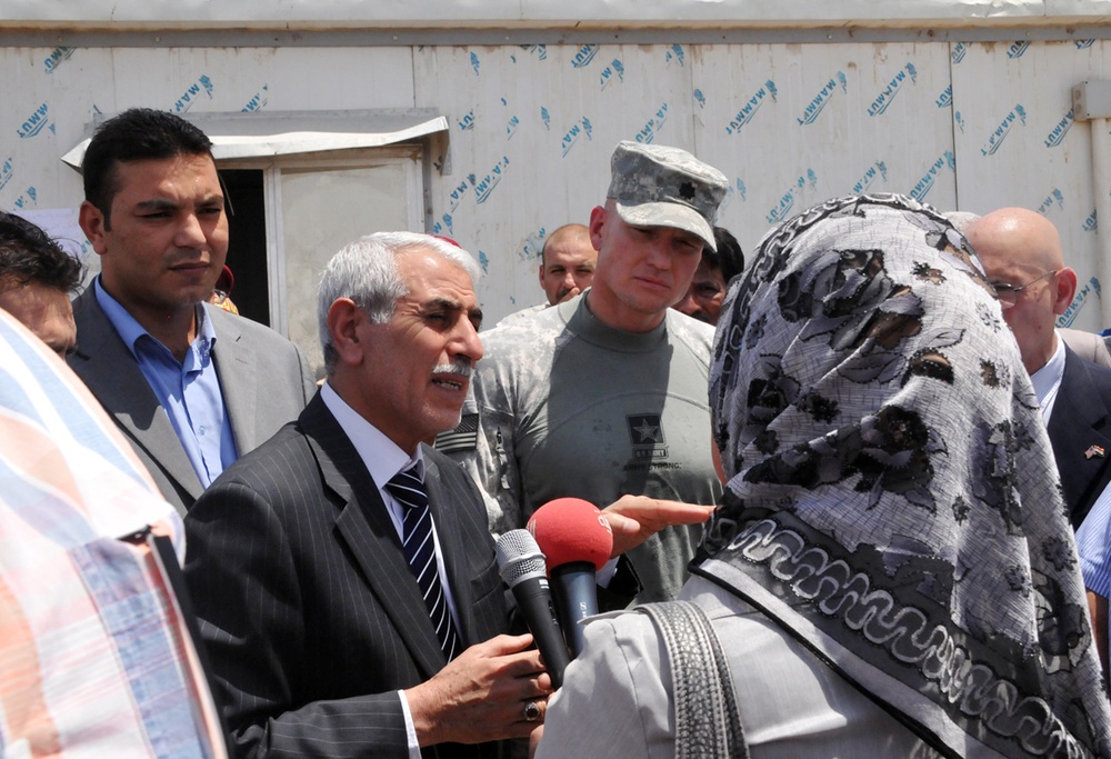 Iraqi Governor Visits Basra Trash Dump with U.S. Army Officer