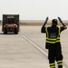Iraqi Worker Guides Vehicle Across Basra Airport Tarmac
