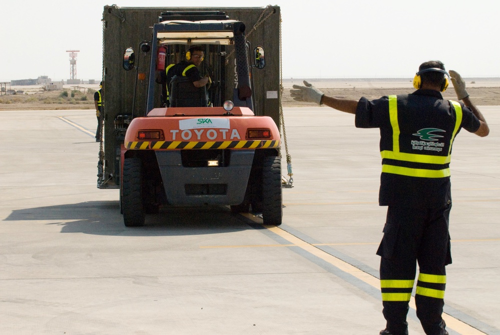 Iraqi Worker Guides Vehicle Across Basra Airport Tarmac