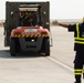 Iraqi Worker Guides Vehicle Across Basra Airport Tarmac