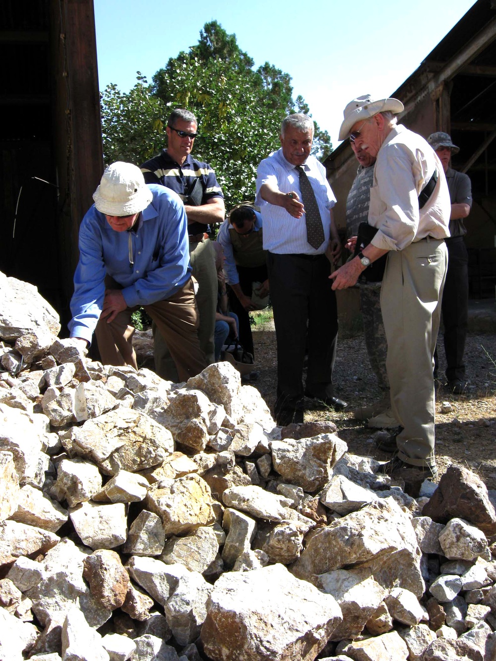 Afghan Cement Plant Manager Shows Key Raw Materials to U.S. Experts