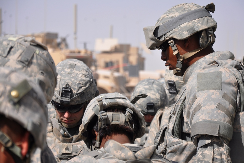 Army Sergeant Leads Soldiers in Prayer Before Combat Logistics Patrol in Afghanistan