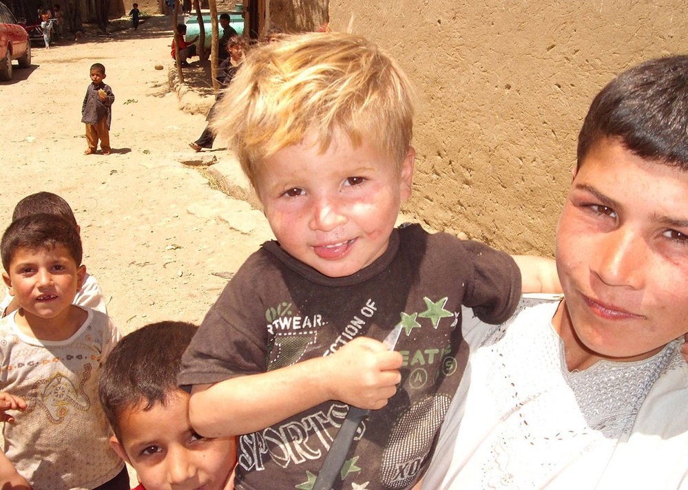Local Children Pose for Photo During U.S. Army Agribusiness Visit in Afghanistan