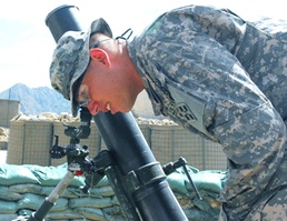 Army Gunnery Sergeant Checks Mortar Tube Azimuth in Afghanistan