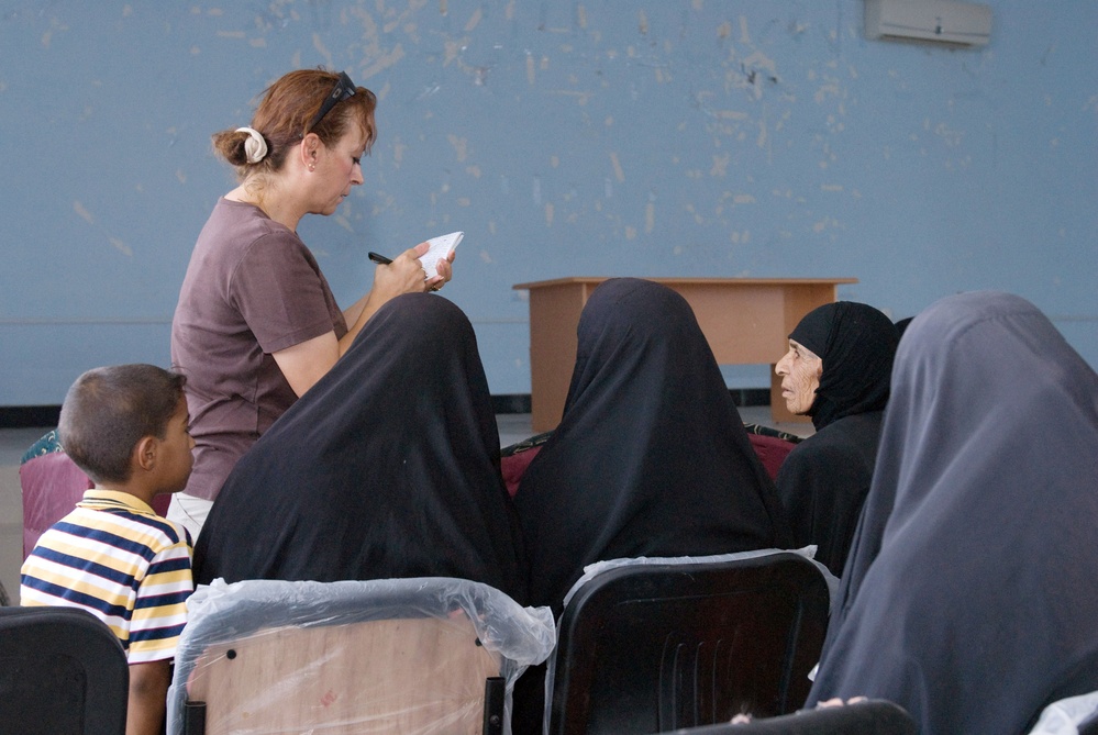 Women's Initiatives Program Advisor Records Participants at Iraq Conference