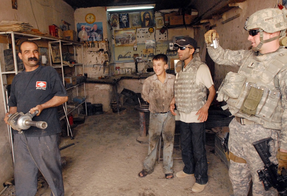 U.S. Soldier Helps Iraqi Businessman Expand Auto Repair Shop