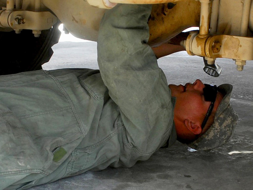 U.S. Soldier Maintains MRAP Vehicle in Afghanistan