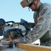 Soldier Builds Covering for New Water Pump at Afghan Outpost