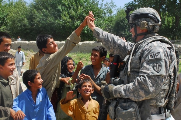 U.S. Soldier Connects with Afghan Child During Polling Site Assessment