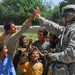 U.S. Soldier Connects with Afghan Child During Polling Site Assessment