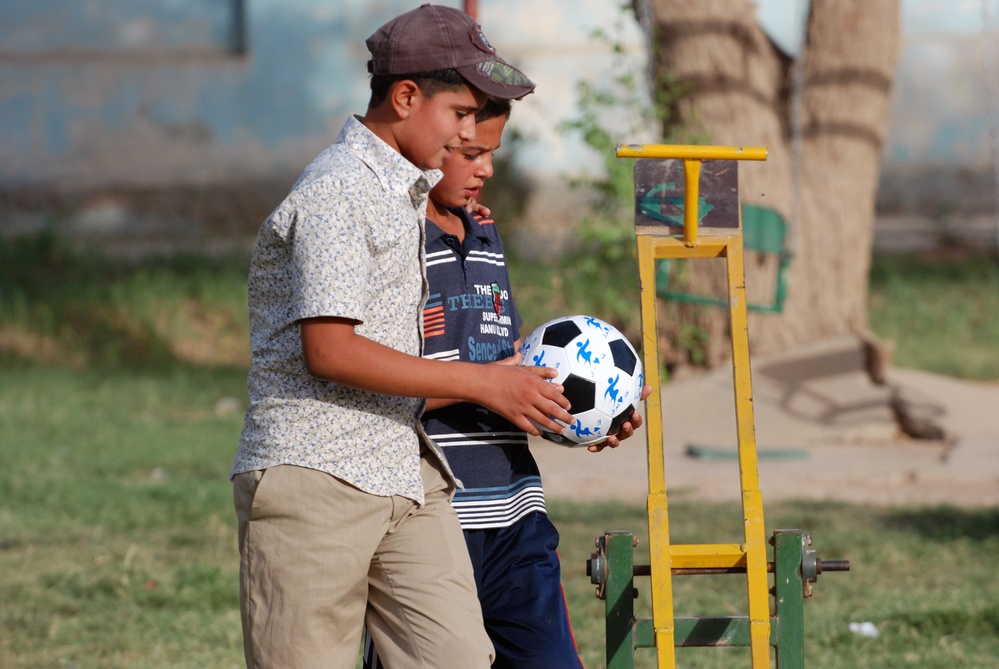 Orphans Receive Soccer Ball Gift from U.S. Soldier in Iraq