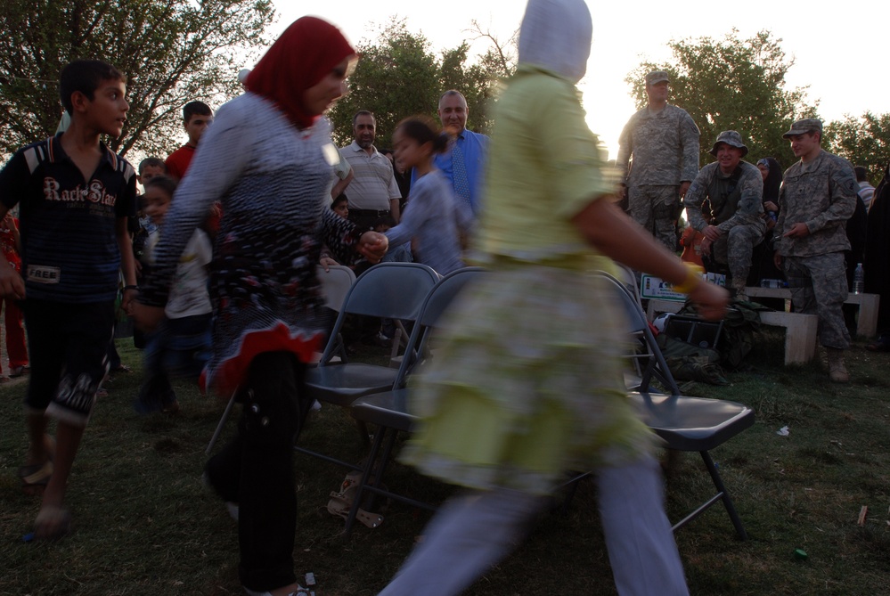 Children Play Musical Chairs at Farewell Event for Kut Orphanage in Iraq