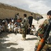 Afghan Army Leader Meets with Village Elders During Aid Mission