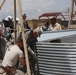 U.S. Troops Assist Afghan Farmers in Assembling Grain Storage Bins