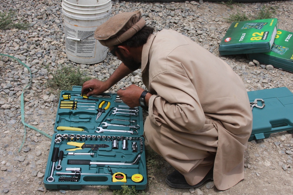 Afghan Farmer Receives Tools from U.S. Agribusiness Team