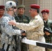 U.S. and Iraqi Army Officers Shake Hands as U.S. Forces Close Gate in Basra