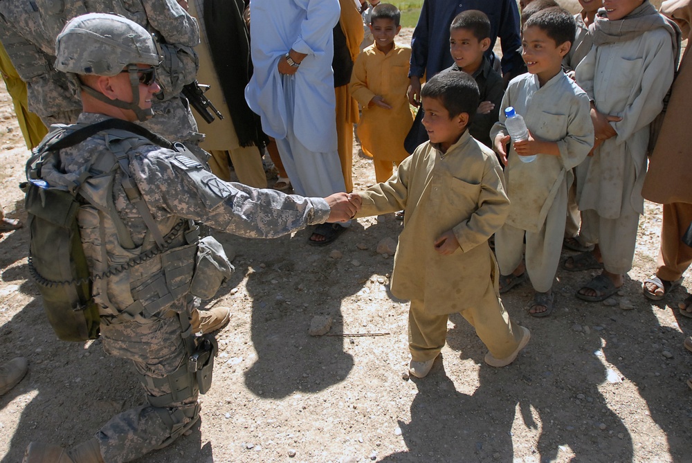 U.S. Soldier Connects with Afghan Villagers During Outreach Mission