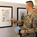 Army Officer Inspects Student Art at Baghdad School