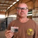 Navy Petty Officer Holds Photo of Family's Military Service