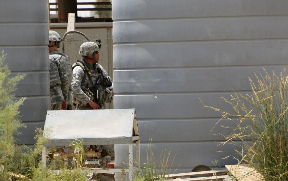 Army Staff Sgt. Inspects Water Reservoirs at Children's Hospital Construction Site in Basra, Iraq
