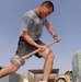 Soldier Trains with Tire and Sledgehammer at Iraqi Base
