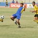 Iraqi Soccer Team Battles for Possession at Shaab Stadium