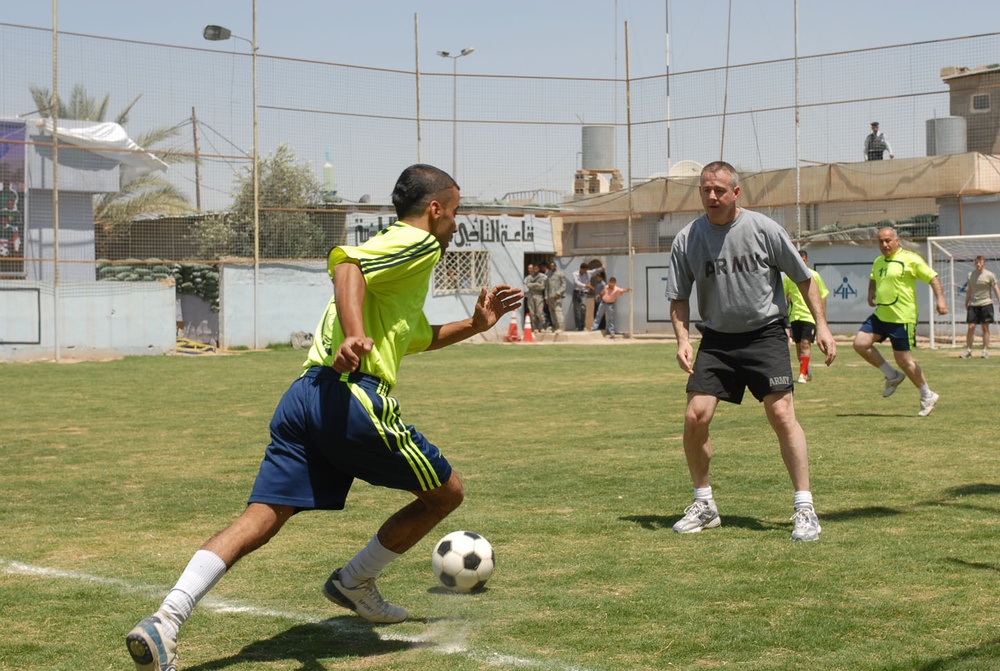 U.S. Army Officer Plays Soccer with Iraqi Police in Kirkuk