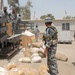 Iraqi National Police Distribute UN Food Aid to Widows in Taji
