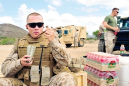 Marine Refuels with Field Ration During Weapons Training in Djibouti