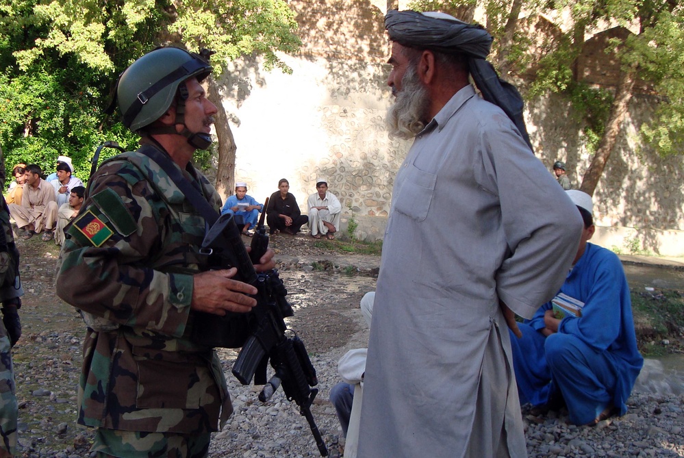 Afghan Commando Commander Meets with Village Elder During Counterterrorism Operation