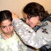 Army Surgeon Examines Afghan Girl's Ear at Women's Clinic