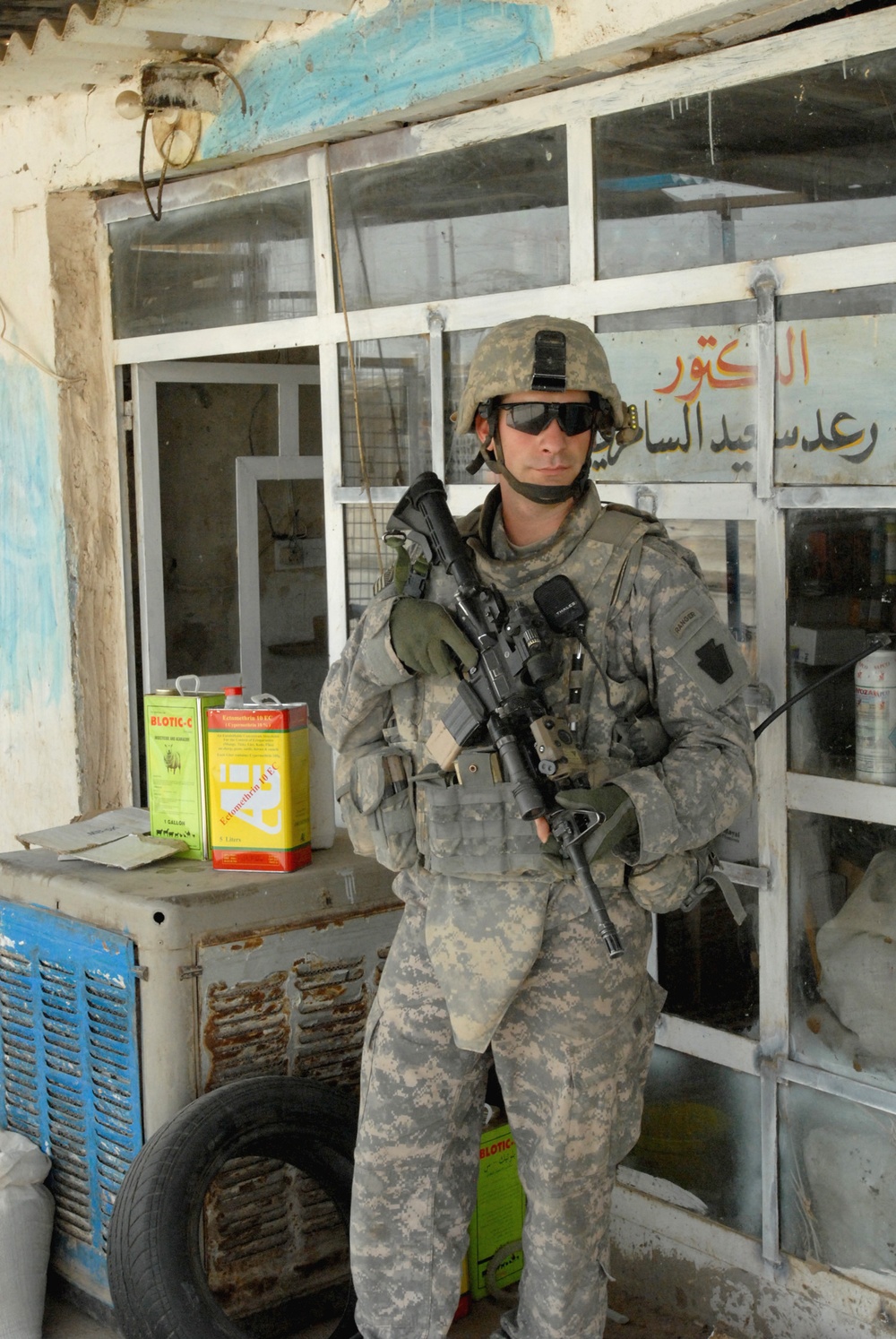 U.S. Soldier Provides Security During Patrol in Iraqi Marketplace