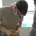 Dental Specialist Examines Afghan Man at Coalition Clinic in Afghanistan