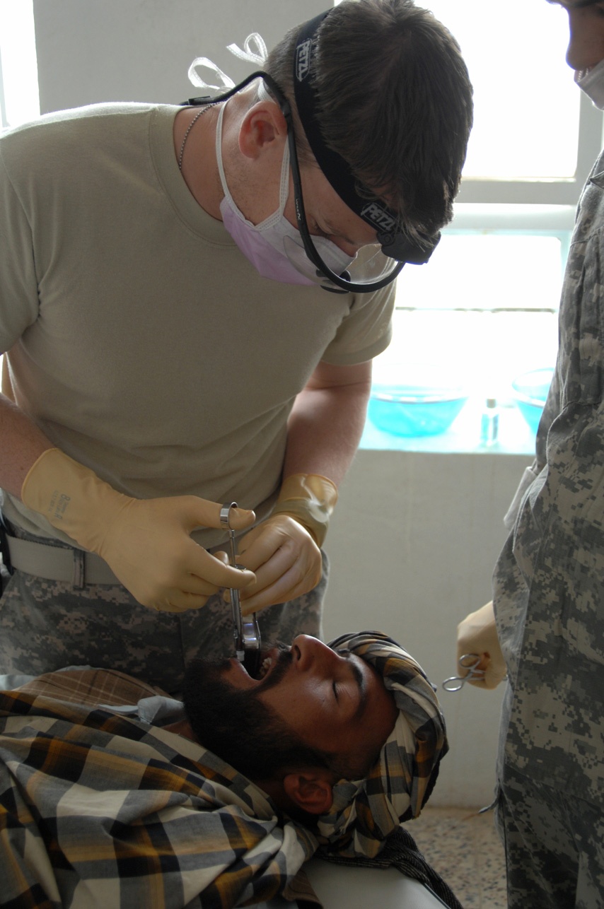 Dental Specialist Examines Afghan Man at Coalition Clinic in Afghanistan