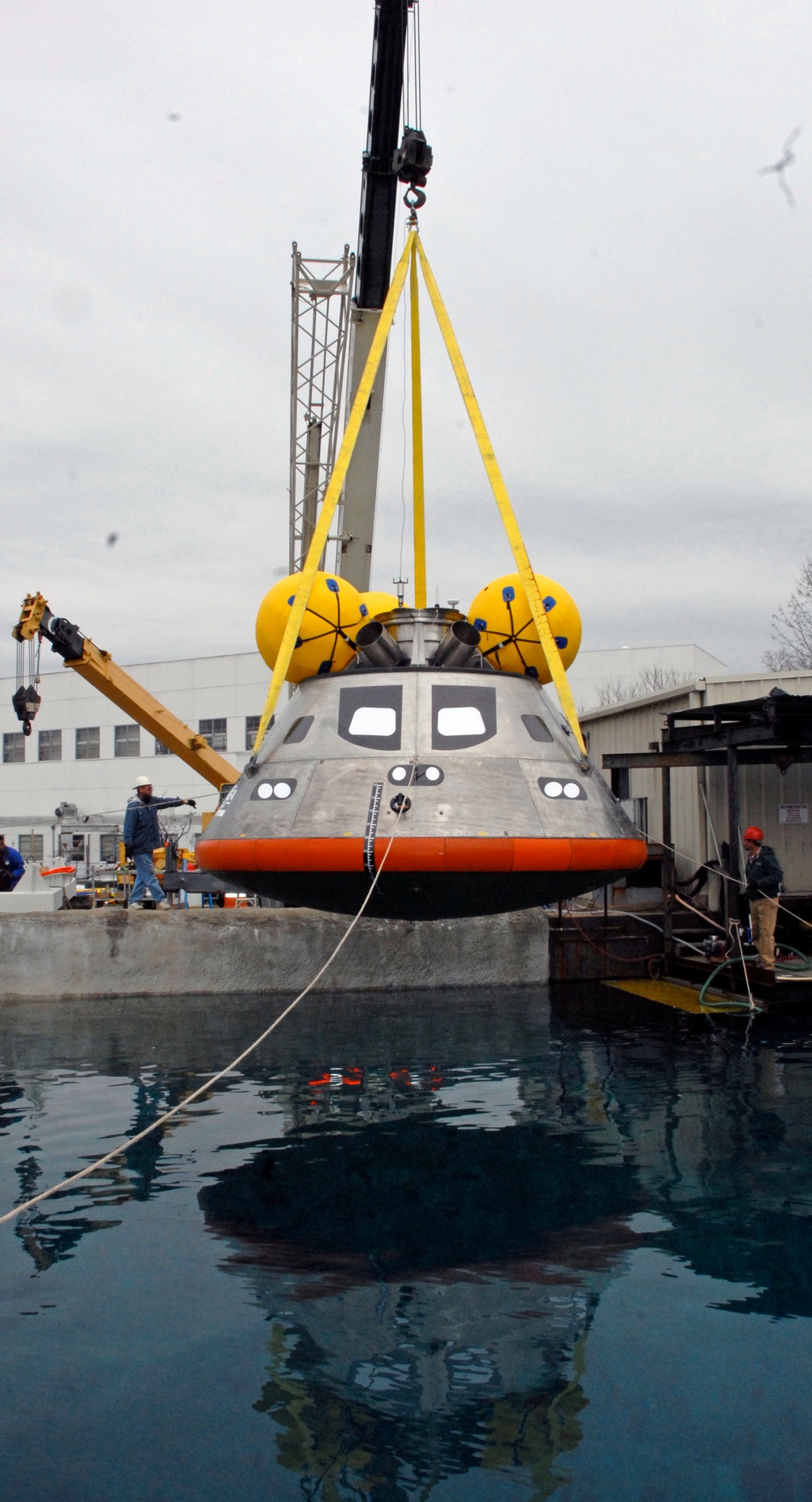 NASA's Orion Crew Module Undergoes Splashdown Test at Naval Facility