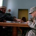 Air Force Officer Reviews Contract Proposal with Afghan Elder