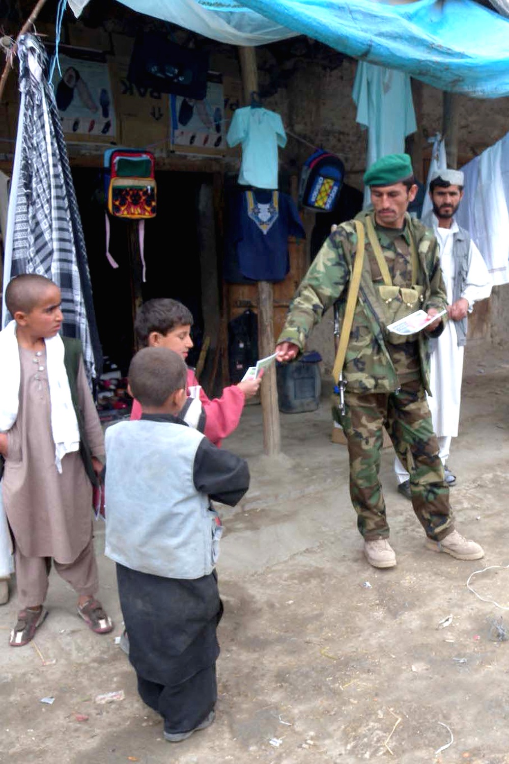 Afghan Soldier Shares Information with Local Children in Alasay Valley