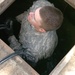 Soldier Maintains Communications in Flooded Afghan Base