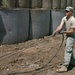 Army Spc. Sudbeck Lays Fiber-Optic Cable at Afghan Base