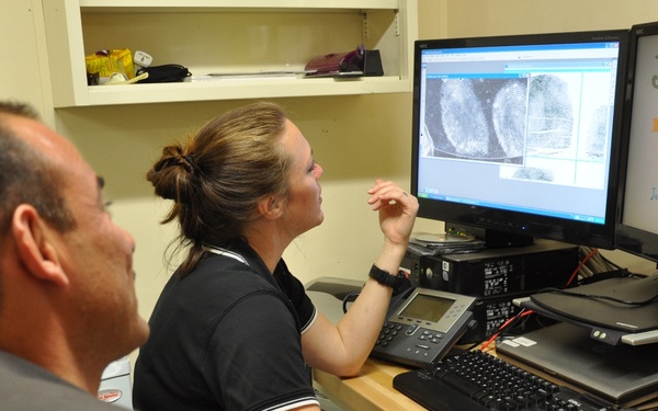Forensic Examiners Analyze Fingerprints in Iraq