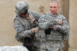 Soldier Prepares Comrade for First Logistics Mission