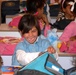 Iraqi Girl Receives Backpack of School Supplies from Coalition Forces