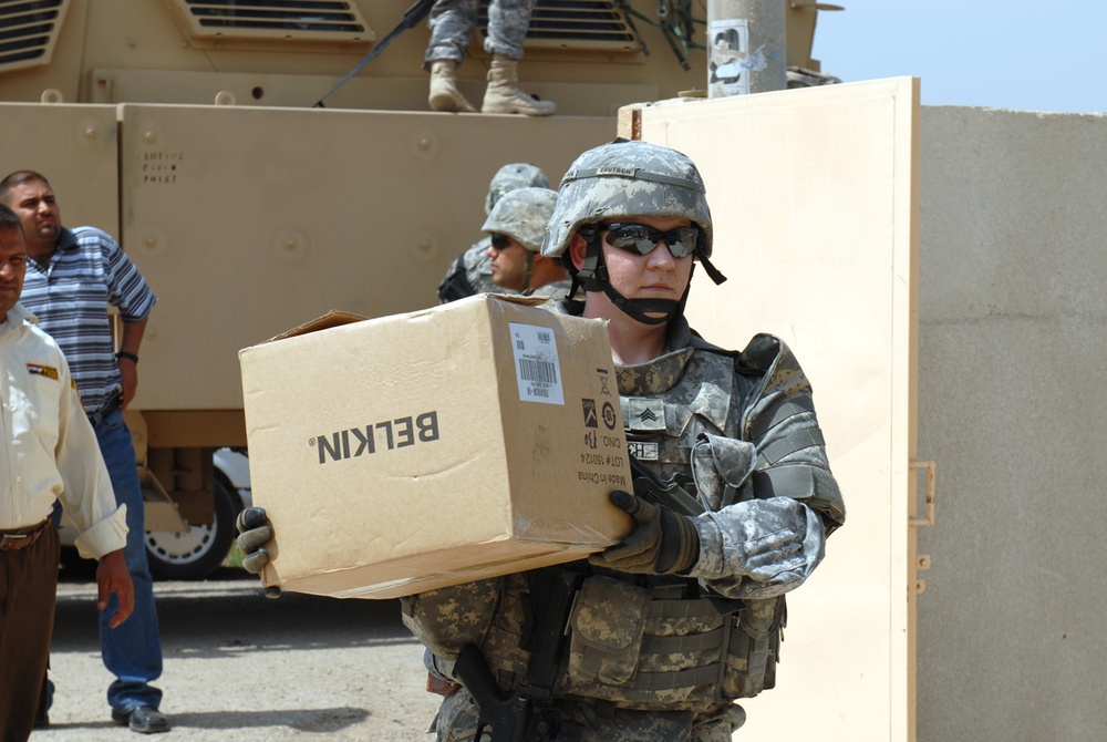 Sgt. Deutsch Helps Unload Supplies for Baghdad School
