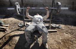 Soldier Lifts Weights at Remote Afghan Outpost