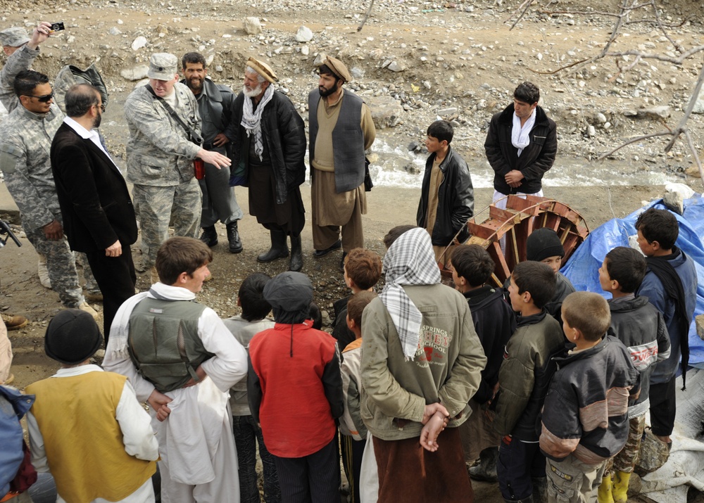 U.S. Air Force Officer Discusses Micro-Hydro Pump with Afghan Villagers