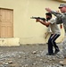 U.S. Soldier Trains Afghan Police in Weapons Tactics