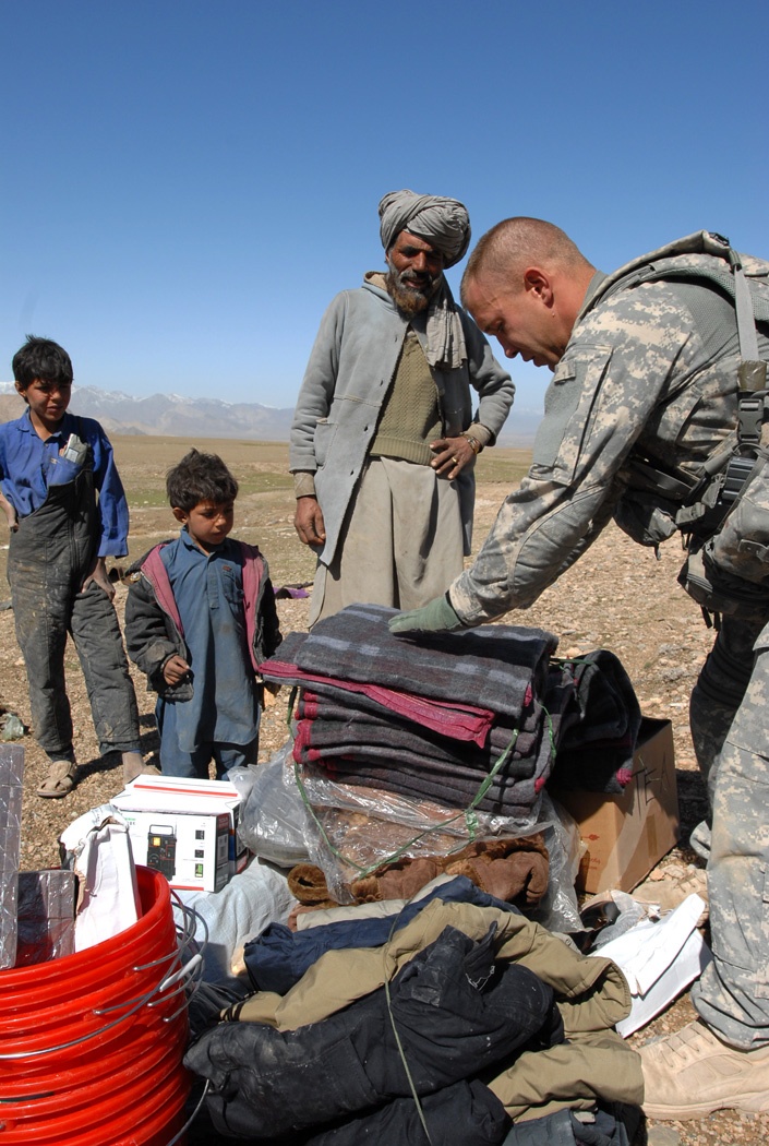 U.S. Soldier Provides Aid to Afghan Nomadic Family